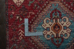 Backside of handmade 2000s Shiraz rug showing knot structure and weave density