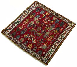 Corner detail of 2000s Shiraz rug showing border pattern and Wool pile