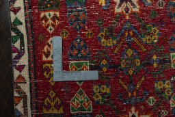 Backside of handmade 2000s Shiraz rug showing knot structure and weave density