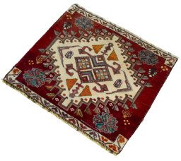 Corner detail of 2000s Shiraz rug showing border pattern and Wool pile