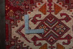 Backside of handmade 2000s Shiraz rug showing knot structure and weave density