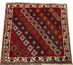 Surface texture of 2000s Shiraz rug with natural Wool and intricate pattern