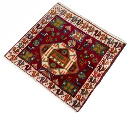 Corner detail of 2000s Shiraz rug showing border pattern and Wool pile