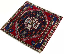 Corner detail of 2000s Shiraz rug showing border pattern and Wool pile