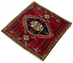 Corner detail of 2000s Shiraz rug showing border pattern and Wool pile
