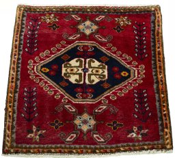 Surface texture of 2000s Shiraz rug with natural Wool and intricate pattern