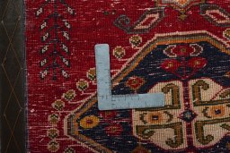 Backside of handmade 2000s Shiraz rug showing knot structure and weave density