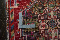 Backside of handmade 2000s Shiraz rug showing knot structure and weave density