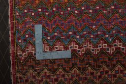 Backside of handmade 1970s Shiraz rug showing knot structure and weave density