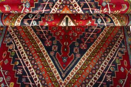 Corner detail of 1970s Shiraz rug showing border pattern and Wool pile