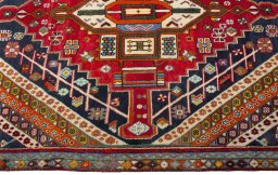 Full view of 1970s Shiraz rug from Iran / Persia, 275 × 137 cm in Multi Color tones