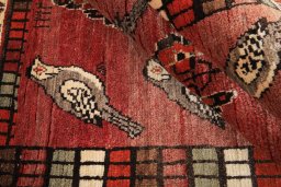 Corner detail of 2000s Shiraz rug showing border pattern and Wool pile