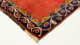 Backside of handmade 1990s Shiraz rug showing knot structure and weave density