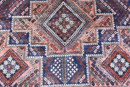 Backside of handmade 1970s Sirjan rug showing knot structure and weave density