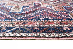 Full view of 1970s Sirjan rug from Iran / Persia, 171 × 132 cm in Red tones