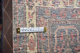 Surface texture of 2000s Sirjan rug with natural Wool and intricate pattern