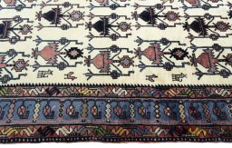 Close-up detail of New Sirjan rug from Iran / Persia showing Wool weave