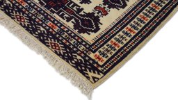 Surface texture of 1960s Torkaman rug with natural Wool and intricate pattern