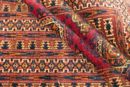 Full view of 1960s Torkaman rug from Uzbekistan, 200 × 114 cm in Dark red tones
