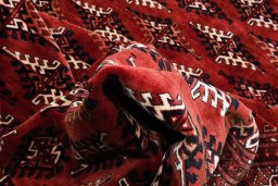 Surface texture of 2000s Torkaman rug with natural Wool and intricate pattern