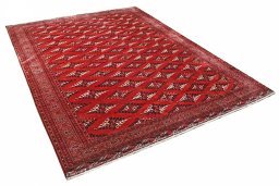Corner detail of 2000s Torkaman rug showing border pattern and Wool pile