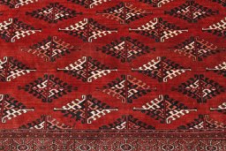 Backside of handmade 2000s Torkaman rug showing knot structure and weave density