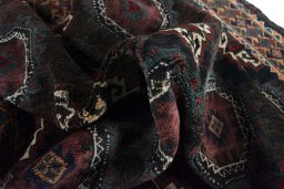 Corner detail of 2000s Torkaman rug showing border pattern and Wool pile