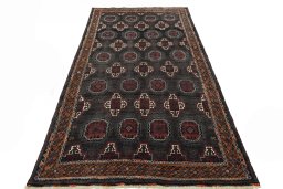 Surface texture of 2000s Torkaman rug with natural Wool and intricate pattern