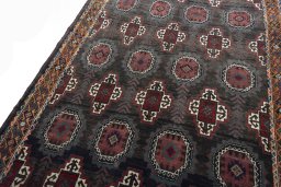 Backside of handmade 2000s Torkaman rug showing knot structure and weave density