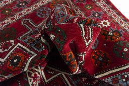 Corner detail of 2000s Torkaman rug showing border pattern and Wool pile