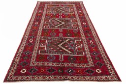 Surface texture of 2000s Torkaman rug with natural Wool and intricate pattern