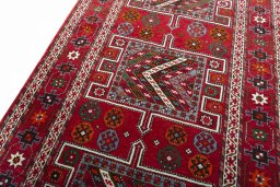 Backside of handmade 2000s Torkaman rug showing knot structure and weave density