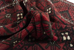 Corner detail of 2000s Torkaman rug showing border pattern and Wool pile