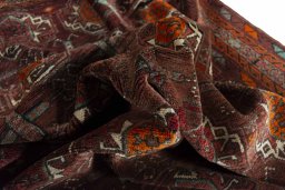 Corner detail of 2000s Torkaman rug showing border pattern and Wool pile