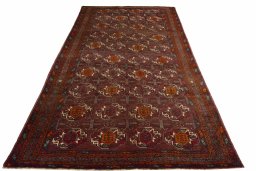 Surface texture of 2000s Torkaman rug with natural Wool and intricate pattern