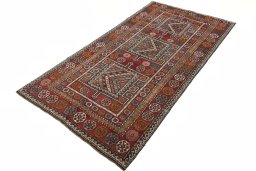 Corner detail of 2000s Torkaman rug showing border pattern and Wool pile