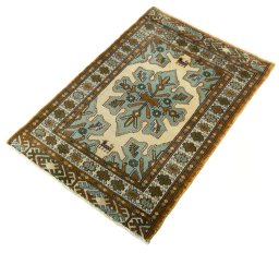 Corner detail of 2000s Torkaman rug showing border pattern and Wool pile