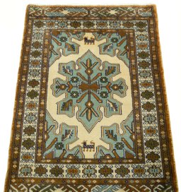 Surface texture of 2000s Torkaman rug with natural Wool and intricate pattern