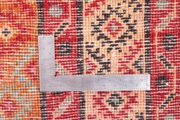 Corner detail of 1995s Torkaman rug showing border pattern and Wool pile