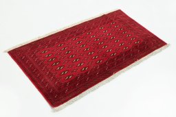 Corner detail of 2000s Torkaman rug showing border pattern and Wool pile