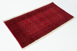 Close-up detail of 2000s Torkaman rug from Iran / Persia showing Wool weave