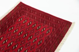 Surface texture of 2000s Torkaman rug with natural Wool and intricate pattern