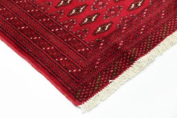 Backside of handmade 2000s Torkaman rug showing knot structure and weave density