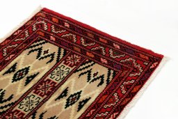 Surface texture of 2000s Torkaman rug with natural Wool and intricate pattern