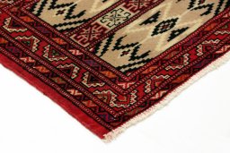 Backside of handmade 2000s Torkaman rug showing knot structure and weave density