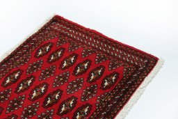 Surface texture of 2000s Torkaman rug with natural Wool and intricate pattern