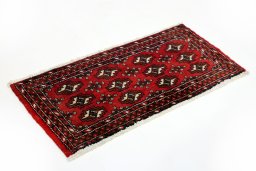 Corner detail of 2000s Torkaman rug showing border pattern and Wool pile