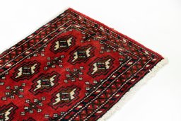 Surface texture of 2000s Torkaman rug with natural Wool and intricate pattern