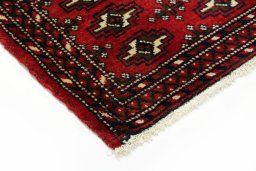 Backside of handmade 2000s Torkaman rug showing knot structure and weave density