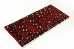 Close-up detail of 2000s Torkaman rug from Iran / Persia showing Wool weave